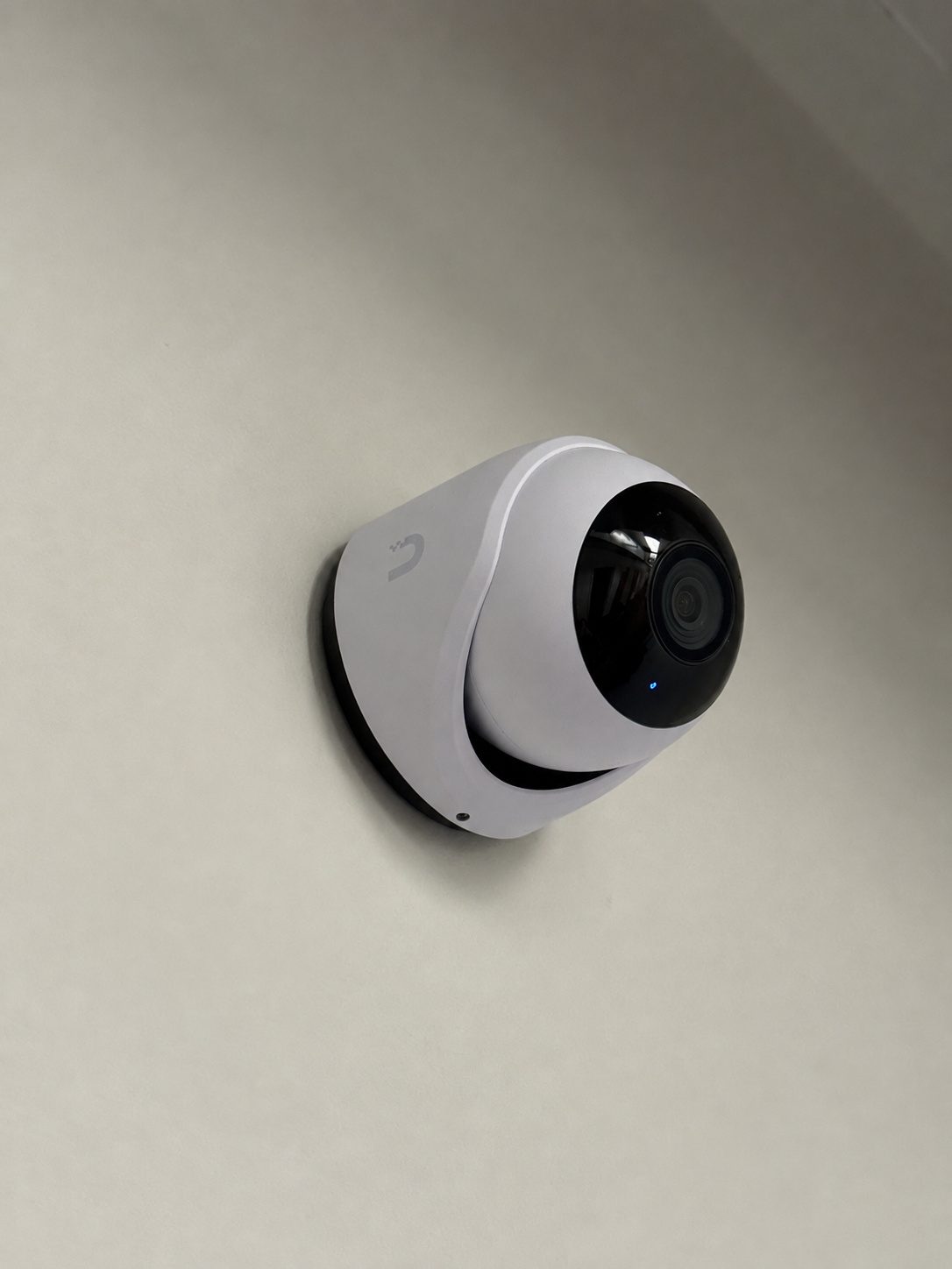 Wall-mounted dome, cabling concealed behind the base.